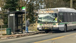 A man boards a BC Transit bus. A man boards a BC Transit bus.