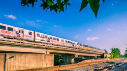 A MARTA train drives down an elevated track. A MARTA train drives down an elevated track.
