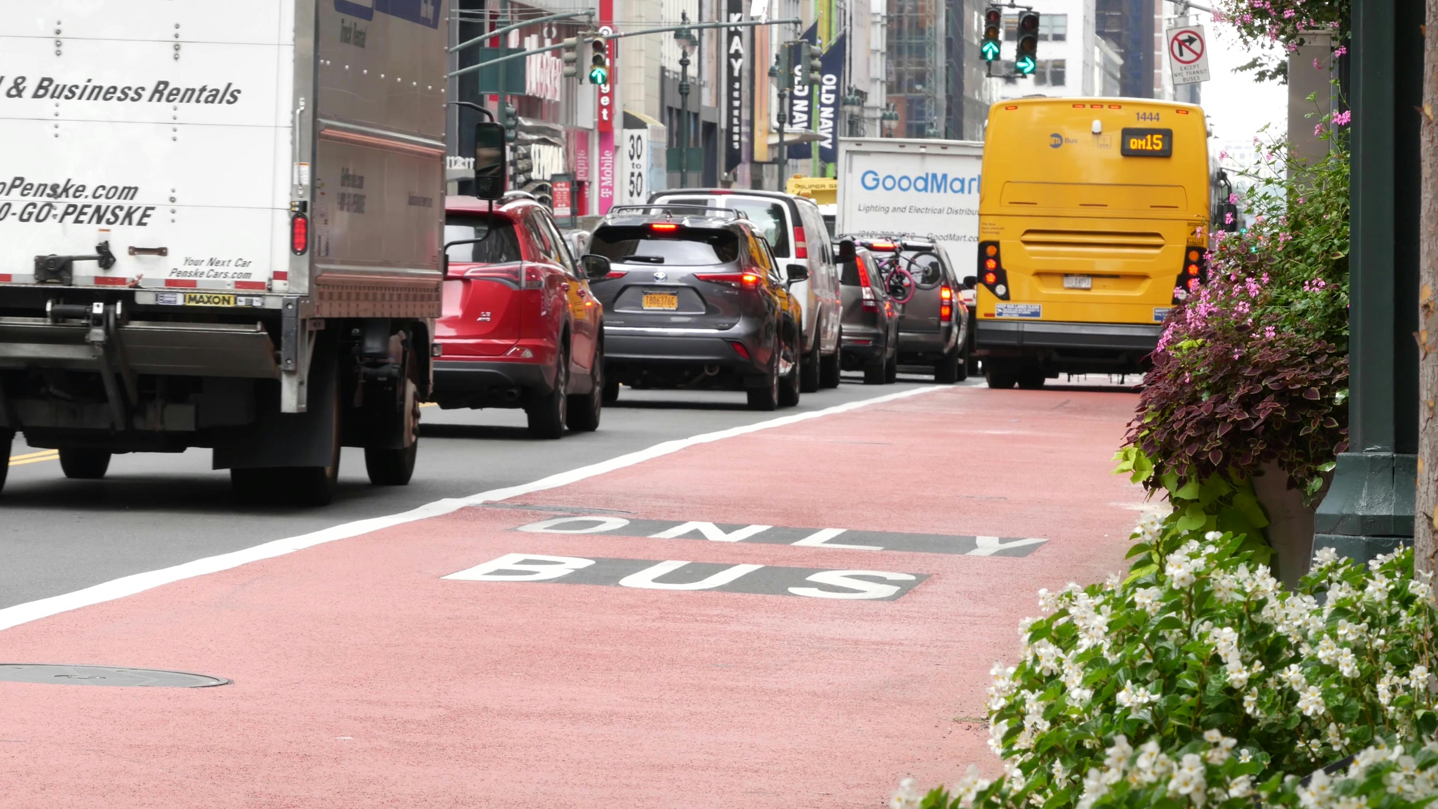 A MTA bus moves down a bus only lane.