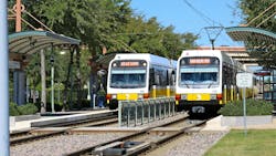 DART trains sit at a station. DART trains sit at a station.