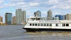 A NY Waterway ferry moves through the water. A NY Waterway ferry moves through the water.