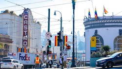 The image shows an intersection hosting a new set of signage. The image shows an intersection hosting a new set of signage.