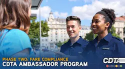 Two ambassadors chat with a passenger.