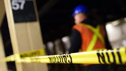 The image shows a blurred construction worker conducting work in the 57th Street station. The image shows a blurred construction worker conducting work in the 57th Street station.