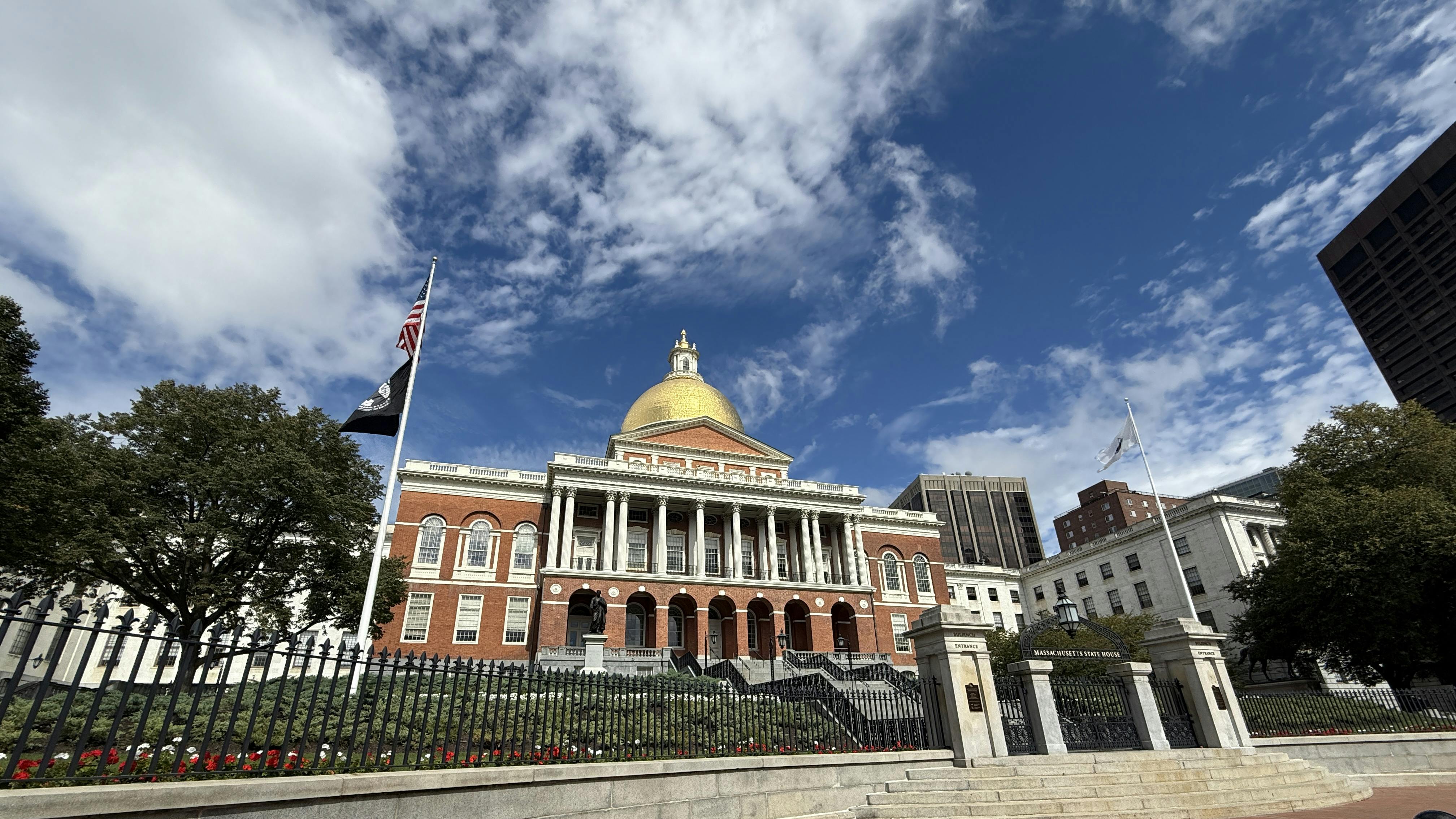 The image shows a wide angle shot of the Massachusetts State House