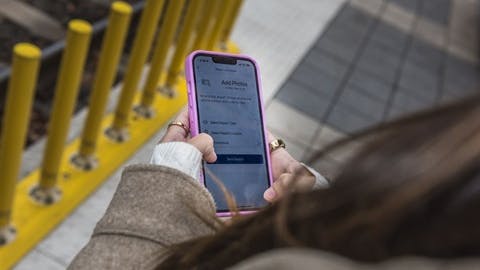 A woman uses the online CATS report tool.