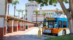 An OCTA bus sits parked outside of the Santa Ana Transit Center. An OCTA bus sits parked outside of the Santa Ana Transit Center.