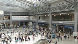 Passengers mill about Moynihan Train Hall. Passengers mill about Moynihan Train Hall.