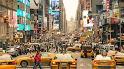 Rush hour with cabs and melting pot people in New York.