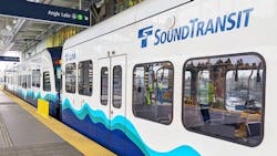 A Sound Transit rail vehicle sits at a station. A Sound Transit rail vehicle sits at a station.