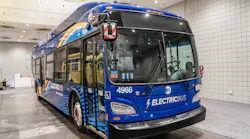An electric MTA bus sits parked at a depot.
