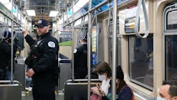 Police officers on a CTA train. Police officers on a CTA train.