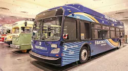 A Metropolitan Transportation Authority New Flyer Xcelsior XD60 electric bus at New York International Auto Show in a row, corner view.