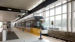 A light-rail vehicle enters the Mount Dennis station, showcasing accessibility features like tactile guiding paths and level boarding platforms. A light-rail vehicle enters the Mount Dennis station, showcasing accessibility features like tactile guiding paths and level boarding platforms.