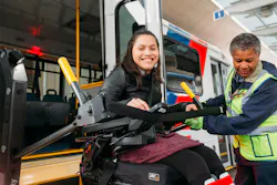 A passenger getting off of a METROLift bus. A passenger getting off of a METROLift bus.
