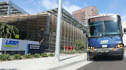 A Commuter Express bus sits next to the LADOT building. A Commuter Express bus sits next to the LADOT building.