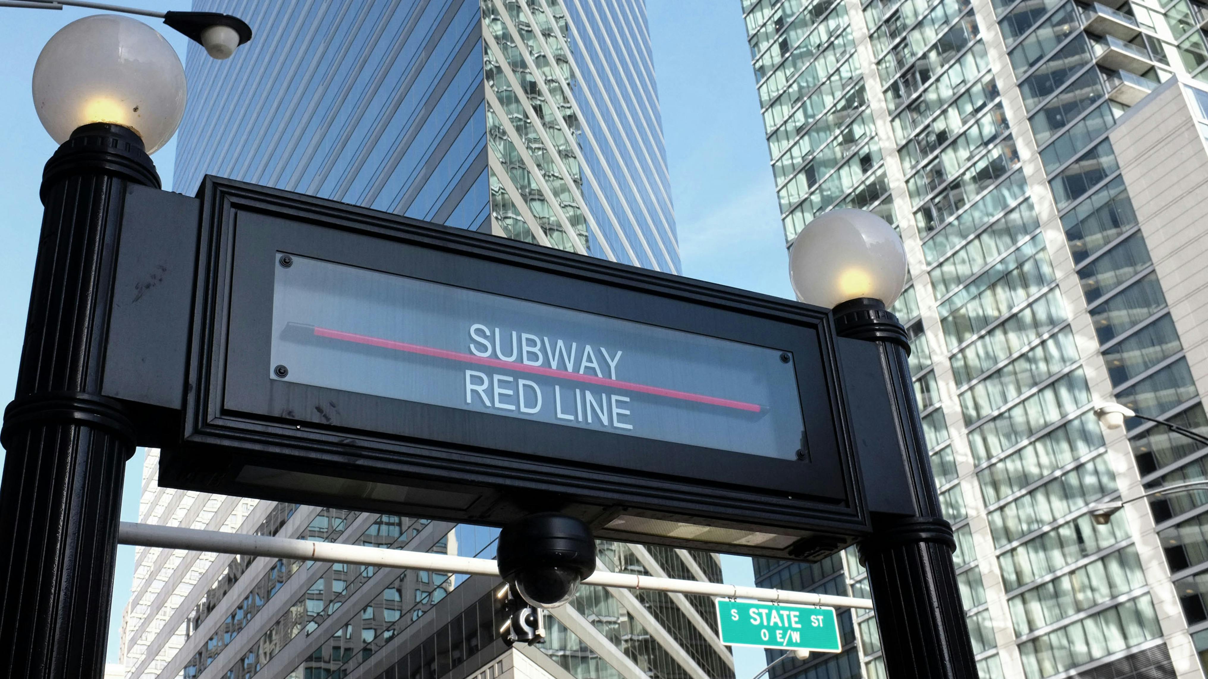 The image shows the sign for a Red Line subway station.