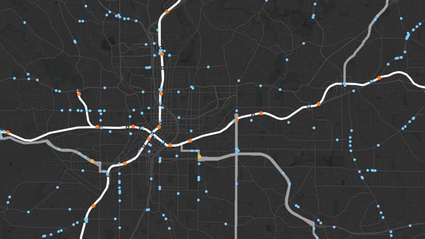 a graphical map is overlaid with lines and dots to mimic transit routes and stops