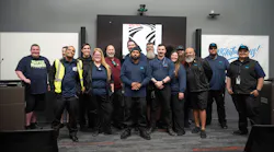 Lane Transit District's new apprenticeship class stands posed with their mentors.