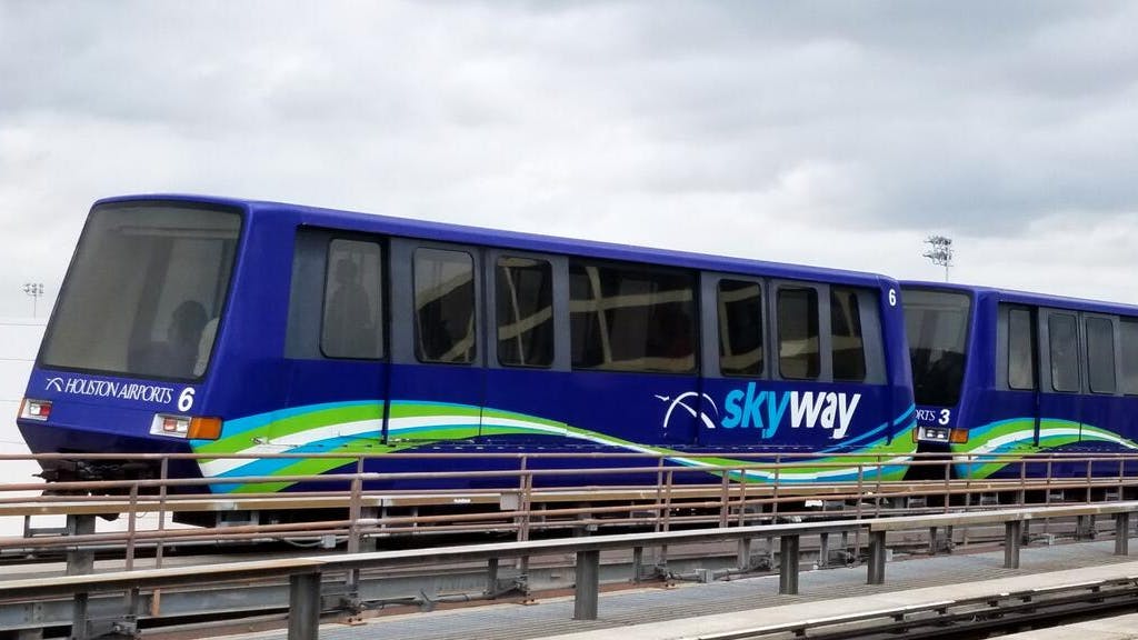 The image shows a current AMP 100 vehicle on the track.