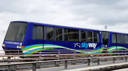 The image shows a current AMP 100 vehicle on the track.