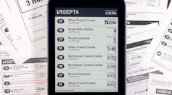 The image displays an e-paper display with transit times displayed.