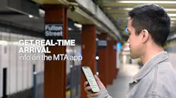 An MTA passengers checks arrival times on the new MTA app while standing on the Fulton Street platform.
