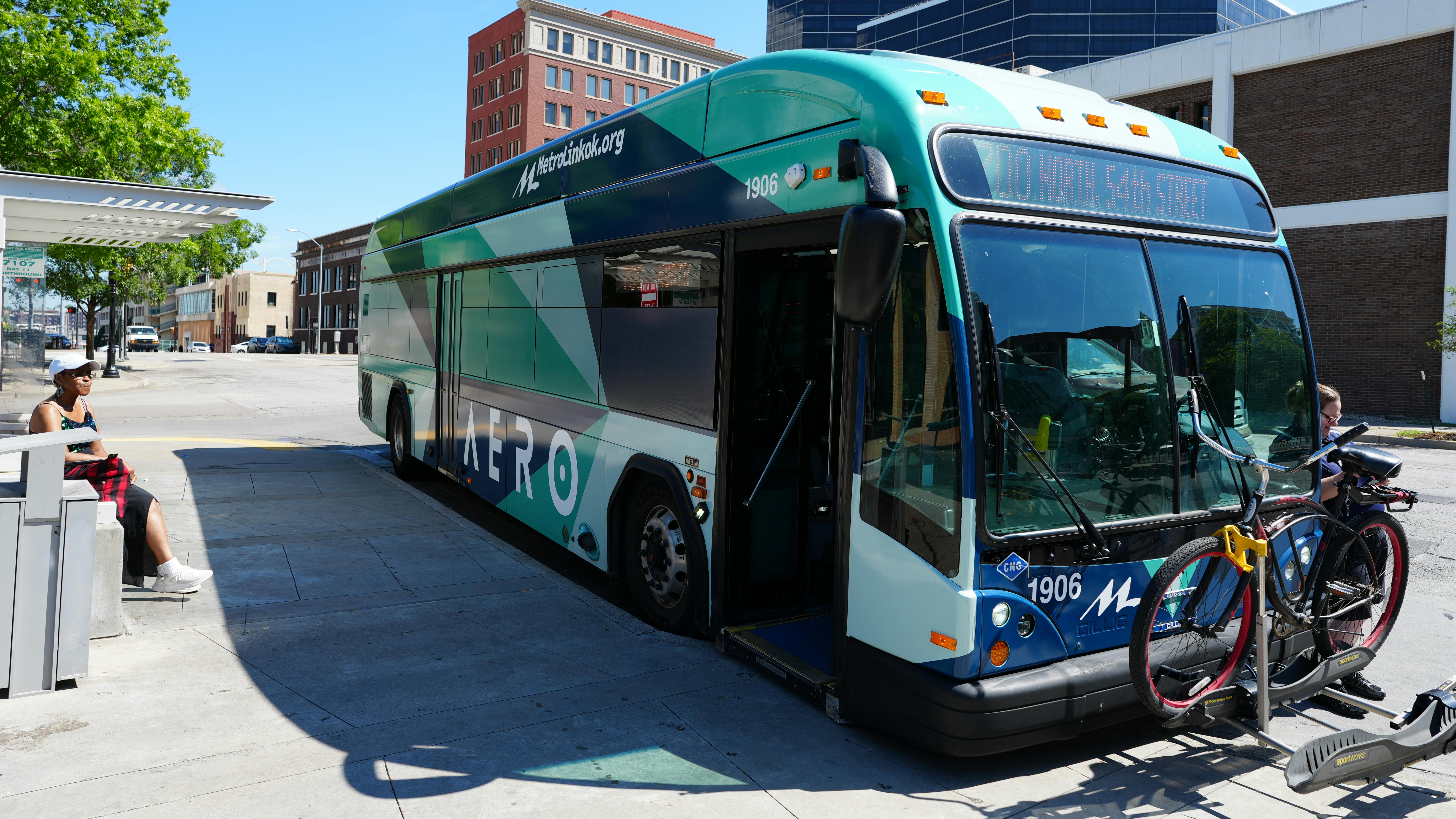 Aero BRT bus at a BRT stop with a bike on the front bike rack