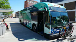 Aero BRT bus at a BRT stop with a bike on the front bike rack