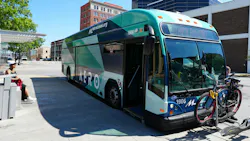 Aero BRT bus at a BRT stop with a bike on the front bike rack Aero BRT bus at a BRT stop with a bike on the front bike rack
