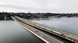 The image shows the new Crosslake Connection bridge over the water.
