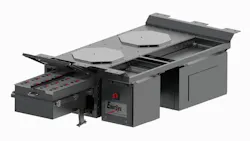 A 3D product rendering of an EnerSys transit battery enclosure on a white background. The large gray metal housing features two octagonal access panels on the top surface, a hinged drawer-style compartment at left revealing internal battery connections, and an EnerSys-branded front panel with a red safety disconnect switch. Mounting flanges are visible along the top edges. A 3D product rendering of an EnerSys transit battery enclosure on a white background. The large gray metal housing features two octagonal access panels on the top surface, a hinged drawer-style compartment at left revealing internal battery connections, and an EnerSys-branded front panel with a red safety disconnect switch. Mounting flanges are visible along the top edges.