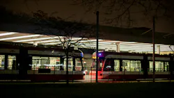 The image shows the Bathurst station illuminated at night with trains sitting in wait. The image shows the Bathurst station illuminated at night with trains sitting in wait.