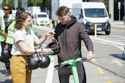 A man accepts one of the 5,000 free helmets the Seattle Department of Transportation gave away last year. A man accepts one of the 5,000 free helmets the Seattle Department of Transportation gave away last year.