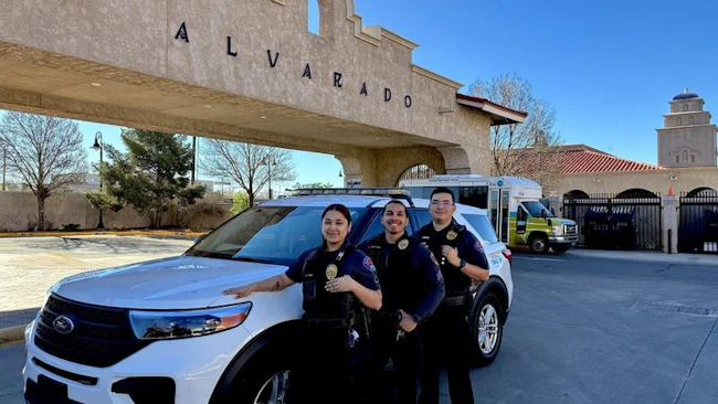 Transit safety officers standing in front of the Alvarado Transportation Center in downtown Albuquerque.