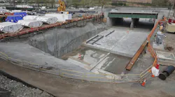 Tunnel boring machine components next to the launch box at the Palisades Portal construction site.