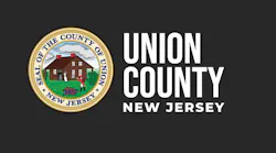 The Union County, New Jersey logo, featuring the county's gold-bordered circular seal depicting a colonial house and Revolutionary War scene dated 1857, alongside 'Union County New Jersey' in white text on a dark gray background.