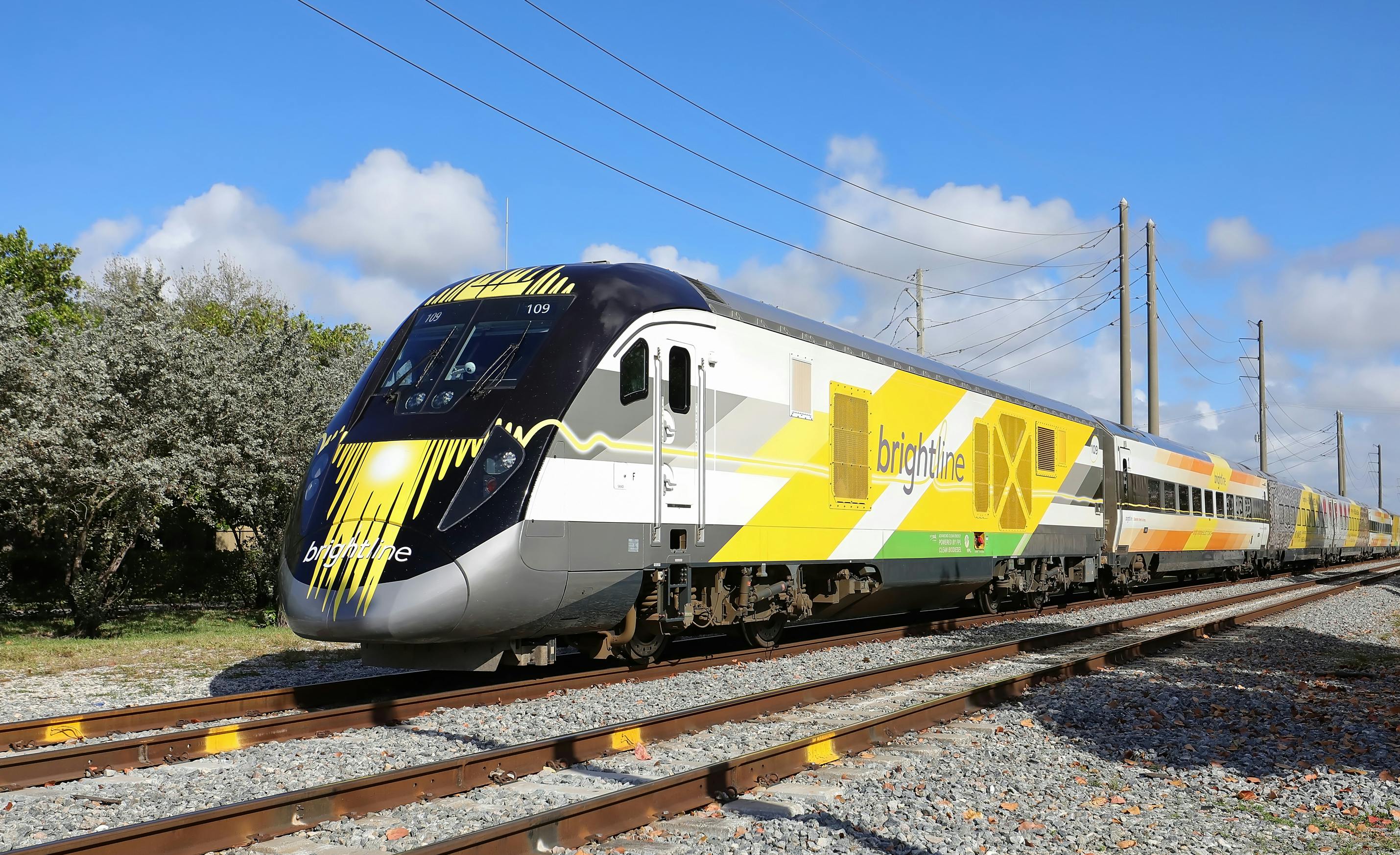 Brightline express train traveling south towards Miami with power lines in the background, as seen on March 14, 2020.