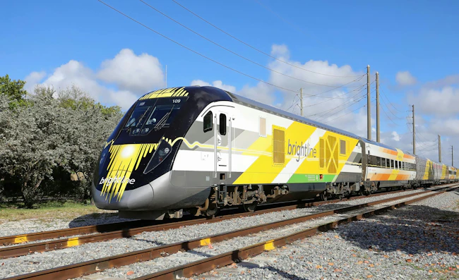 Brightline express train traveling south towards Miami with power lines in the background, as seen on March 14, 2020.
