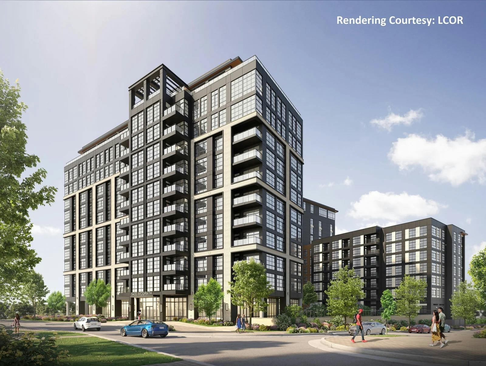 An architectural rendering of LCOR's proposed multi-family residential development at 5400 McGrath in North Bethesda's Parcel H, showing a mid-rise apartment building with brick and dark metal facades, ground-floor retail spaces, landscaped streetscape and pedestrians walking along the sidewalk.