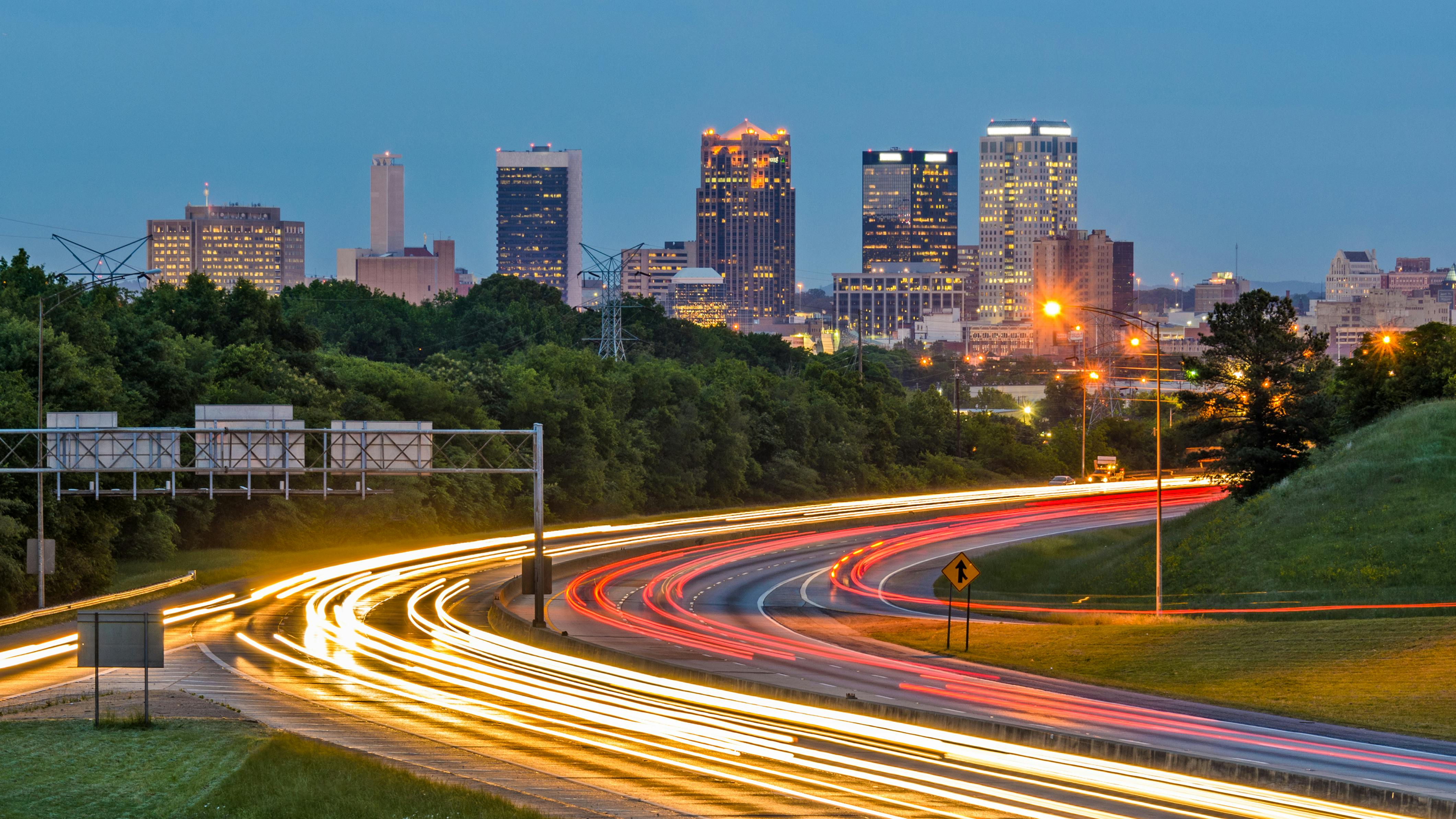 Birmingham, Alabama, USA downtown city skyline with interstate motion blur in foreground