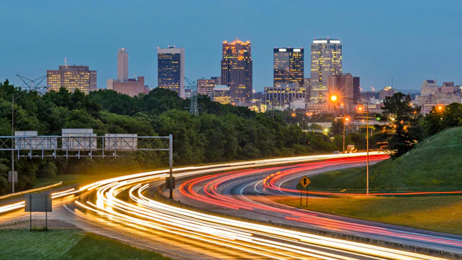 Birmingham, Alabama, USA downtown city skyline with interstate motion blur in foreground