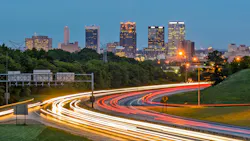 Birmingham, Alabama, USA downtown city skyline with interstate motion blur in foreground