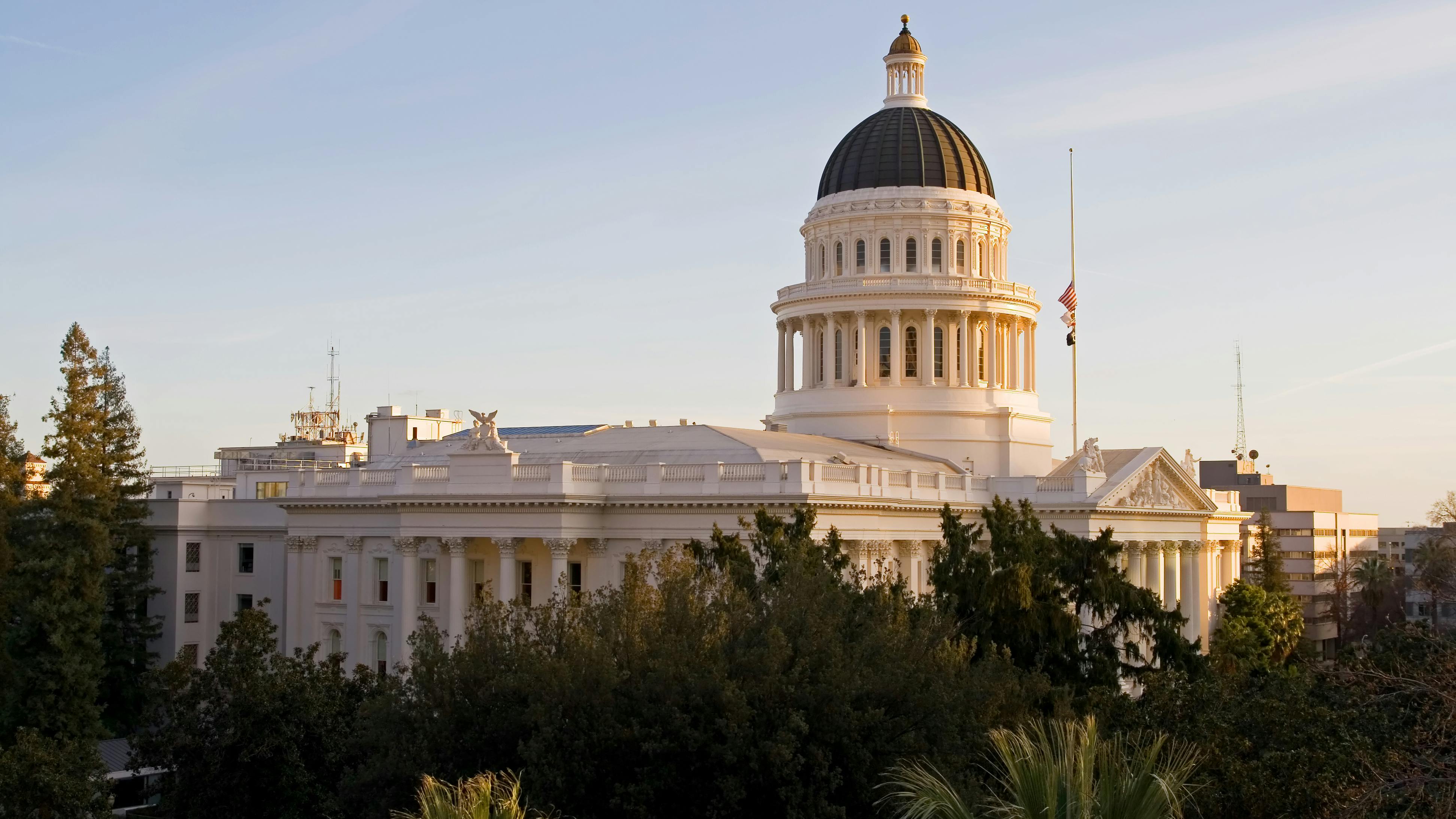 The California State House is photographed at golden hour from the air.