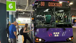 Riders board a purple WeGo Public Transit bus under a '6' sign.