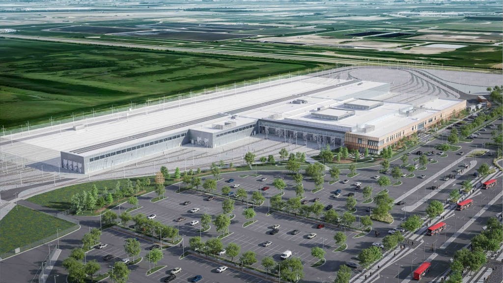 The image displays a rending of what the completed facility will look like&mdash;an airel view of the complex bearing a white roof.