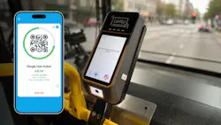 mobile phone with valid ticketing on screen to the left of the fare validator box on a bus