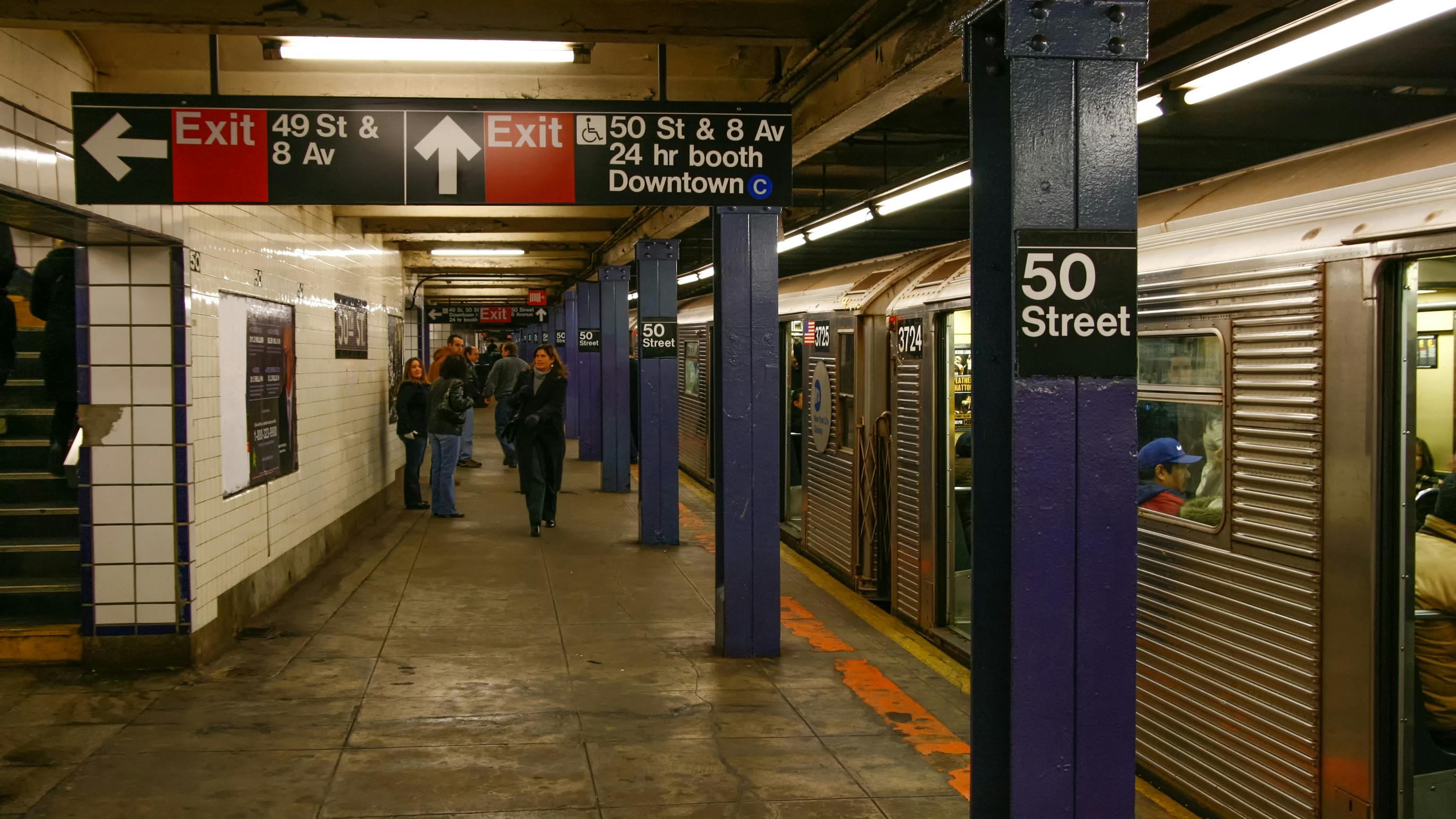 The Metropolitan Transportation Authority 50th Street Subway car station platform and passengers in mid-town Mahattan near the Broadway Theater District in New York City.