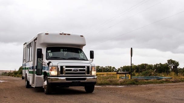 A transit van in a rural area.