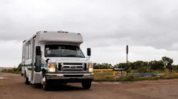 A transit van in a rural area.